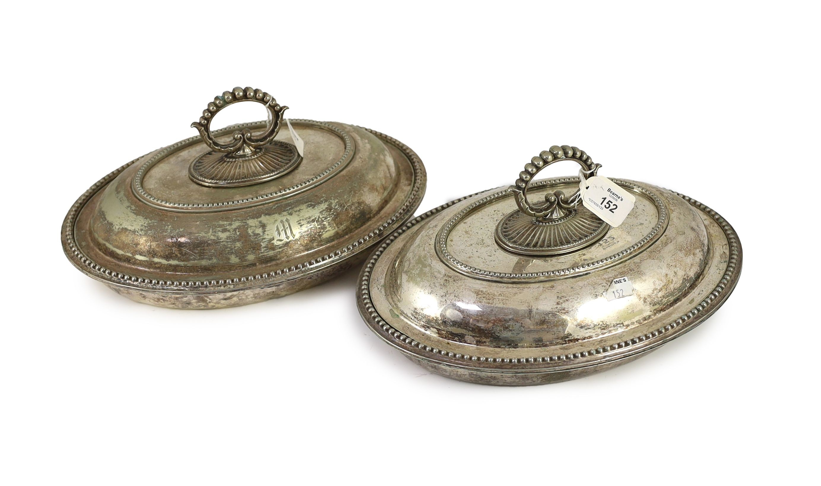A pair of plated oval entree dishes, covers and detachable handles, 31cm wide